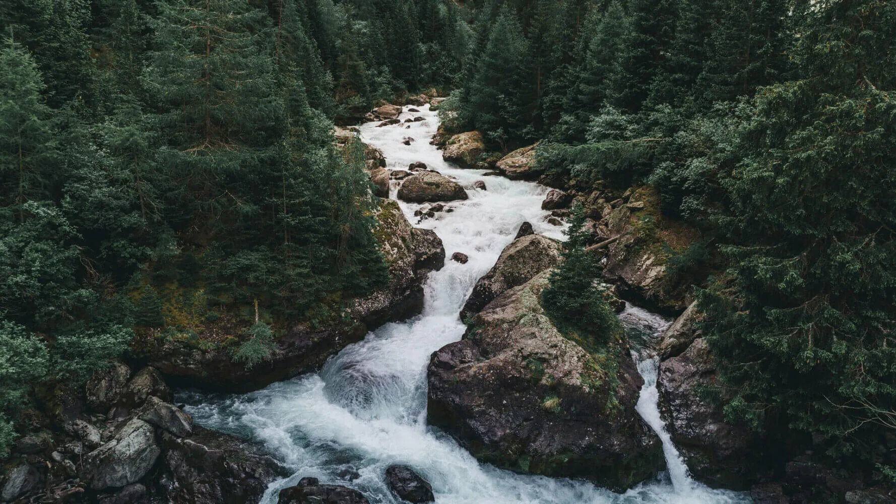 Thornburg Investment Income Builder Fund, water rushes down rocks in a stream